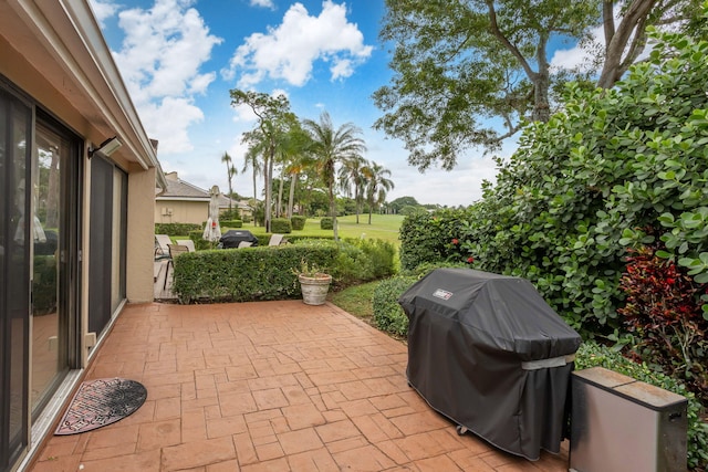 view of patio featuring a grill