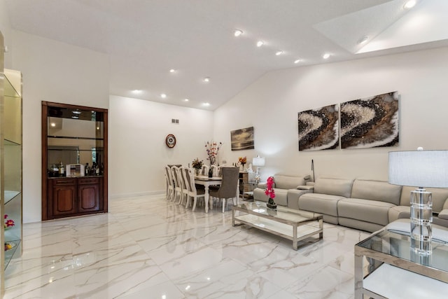 living room featuring vaulted ceiling