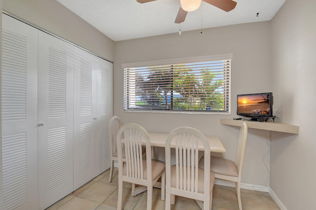 dining room featuring light tile patterned floors and ceiling fan