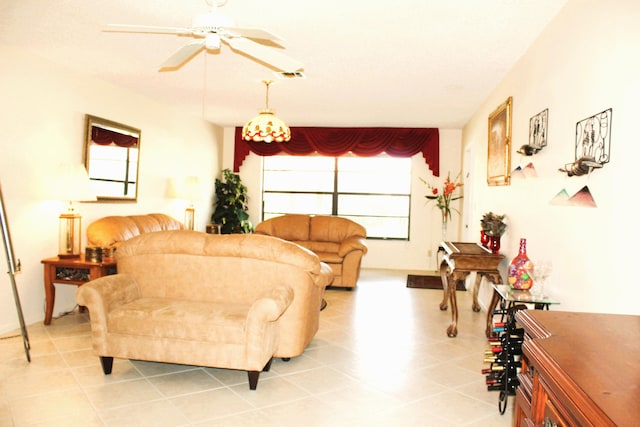 living room featuring ceiling fan and light tile patterned floors