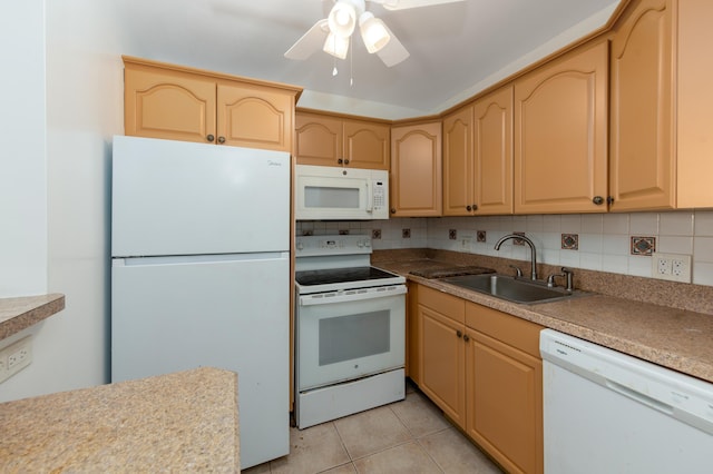 kitchen featuring sink, white appliances, light brown cabinetry, and light tile patterned floors