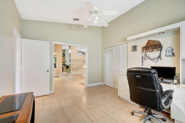 tiled home office with high vaulted ceiling and ceiling fan