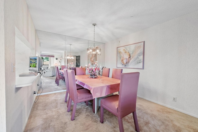 dining room featuring light colored carpet, a textured ceiling, and an inviting chandelier