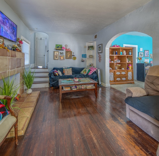 living room featuring dark hardwood / wood-style floors