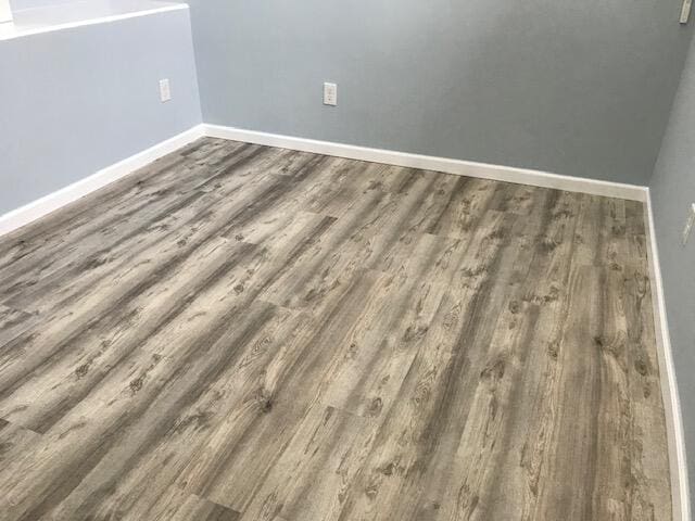 interior details featuring hardwood / wood-style flooring