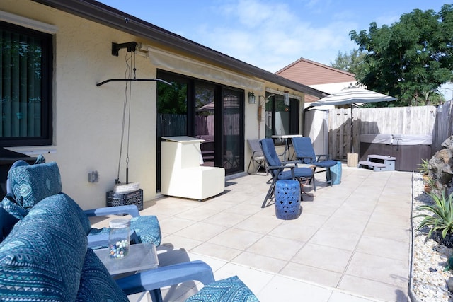 view of patio / terrace featuring a hot tub