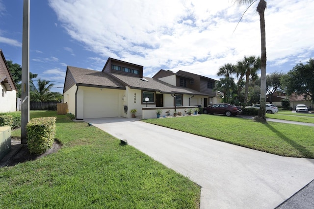 view of front of house with a garage and a front yard