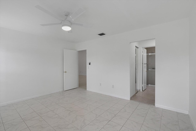 unfurnished room featuring ceiling fan