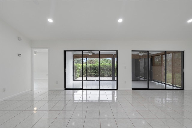 tiled empty room with ceiling fan