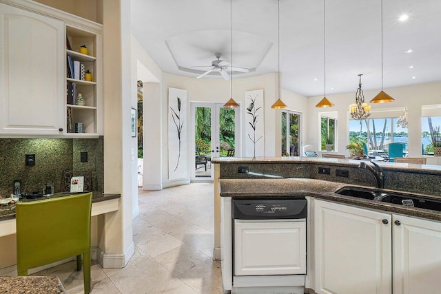 kitchen with white cabinets, a healthy amount of sunlight, pendant lighting, and white dishwasher