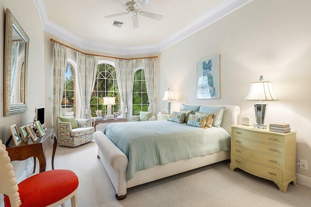 bedroom with carpet, ceiling fan, and crown molding