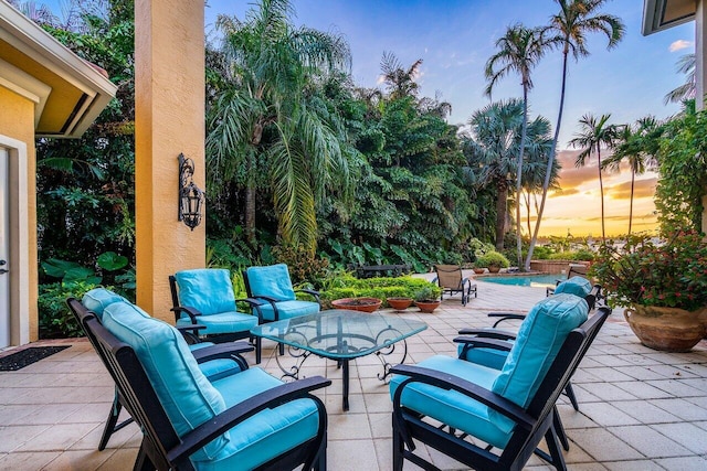 view of patio terrace at dusk