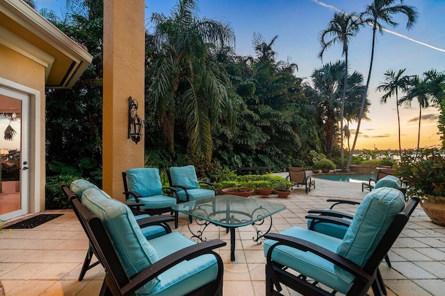 view of patio terrace at dusk