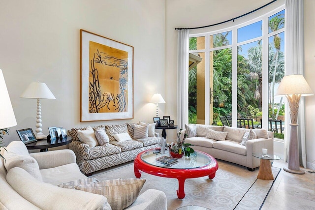 living room featuring ornate columns