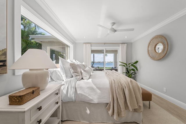 bedroom with ceiling fan, access to exterior, multiple windows, and light hardwood / wood-style flooring