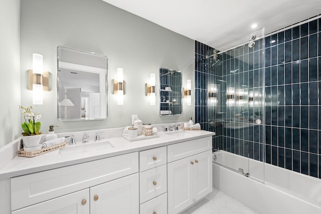 bathroom featuring tile patterned floors, vanity, and shower / bath combination with glass door