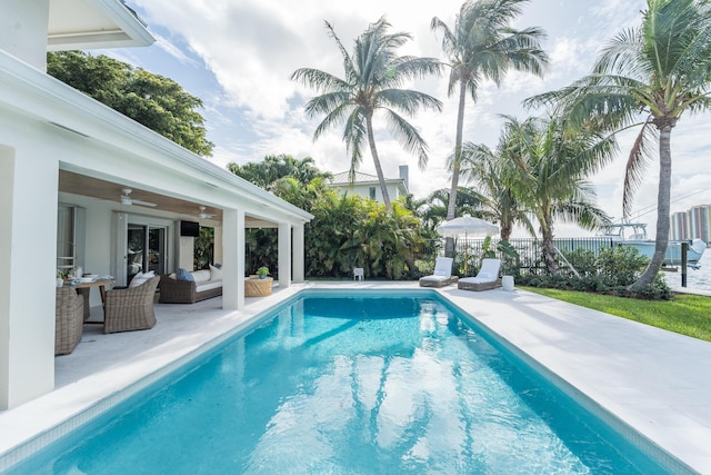 view of pool featuring an outdoor hangout area, ceiling fan, and a patio