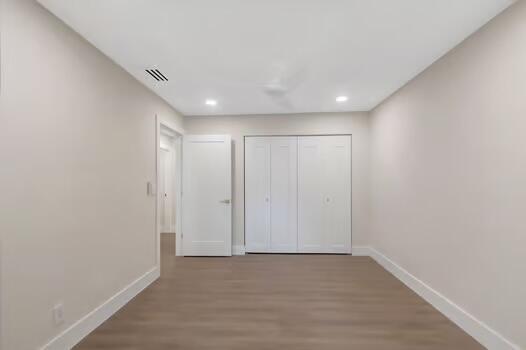 corridor featuring hardwood / wood-style flooring