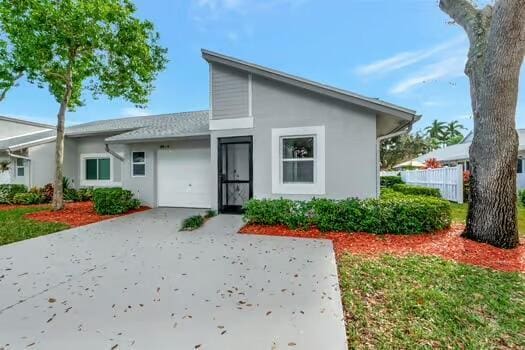 rear view of house with a garage