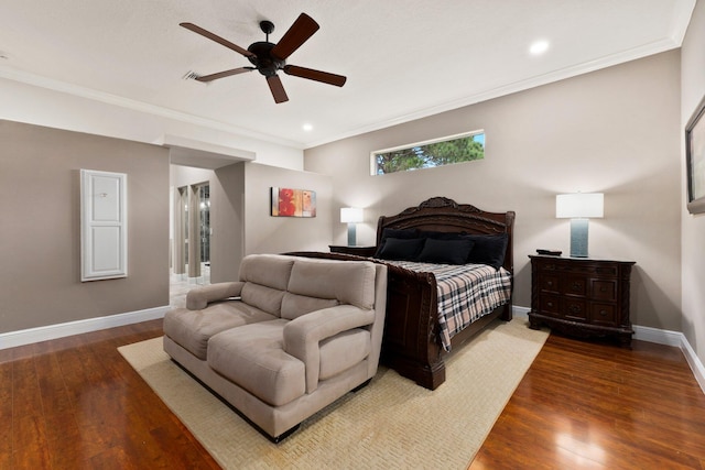 bedroom with ceiling fan, dark hardwood / wood-style floors, and ornamental molding