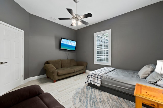 bedroom with ceiling fan and light wood-type flooring