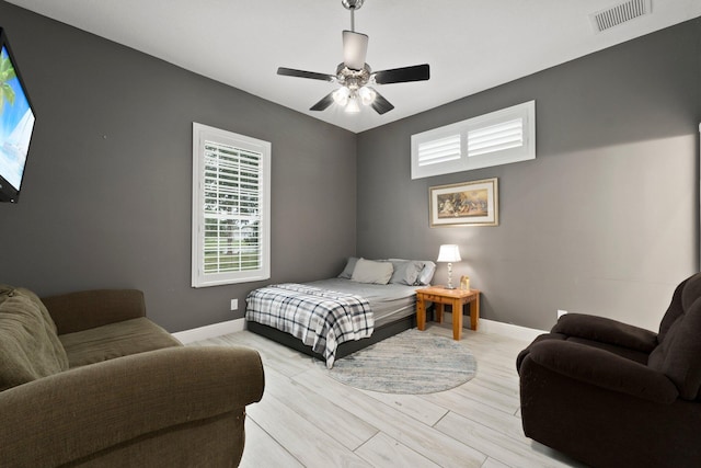 bedroom featuring ceiling fan and light hardwood / wood-style flooring