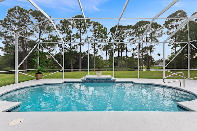 view of pool with a patio area, a lanai, and a yard