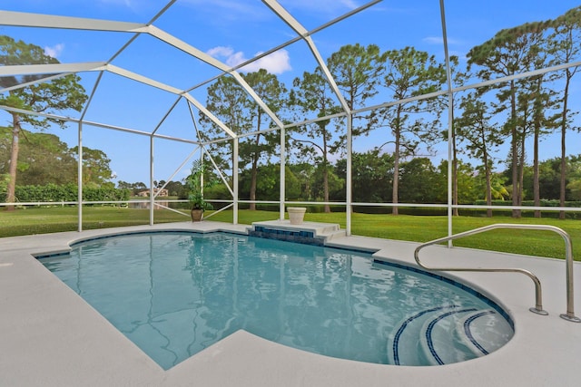 view of pool with a lawn and glass enclosure