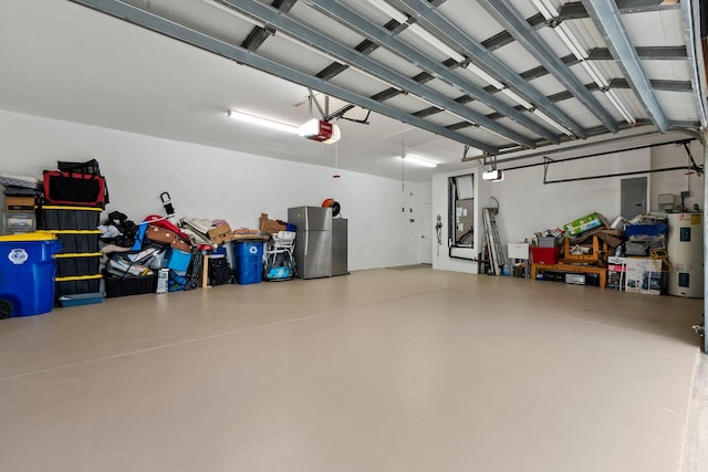 garage featuring stainless steel refrigerator, electric water heater, and a garage door opener