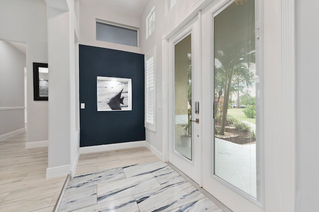 doorway to outside with light wood-type flooring