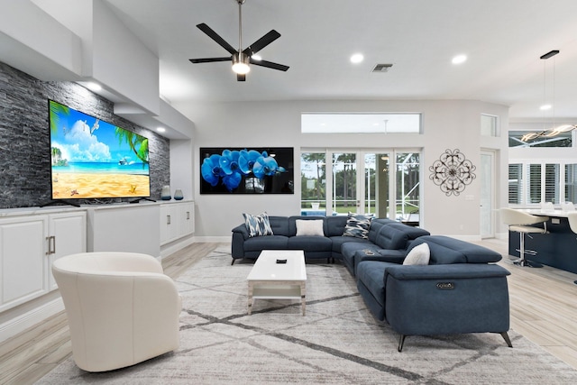 living room featuring light wood-type flooring and ceiling fan