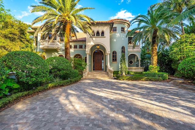 mediterranean / spanish house with a balcony