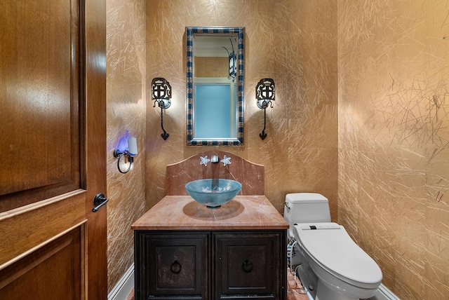 bathroom with vanity and toilet