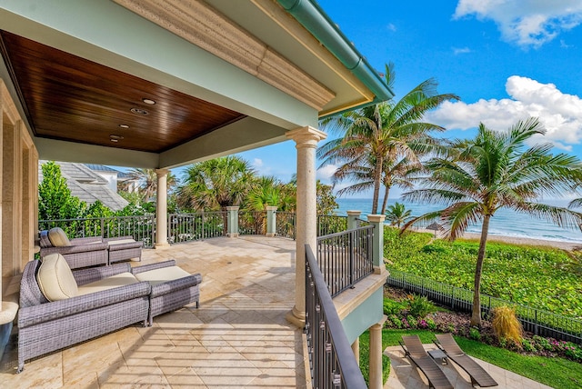 view of patio / terrace with a water view and outdoor lounge area