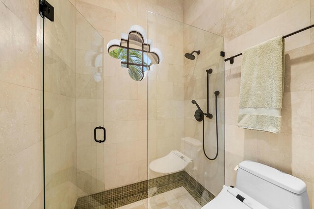 bathroom featuring toilet and walk in shower