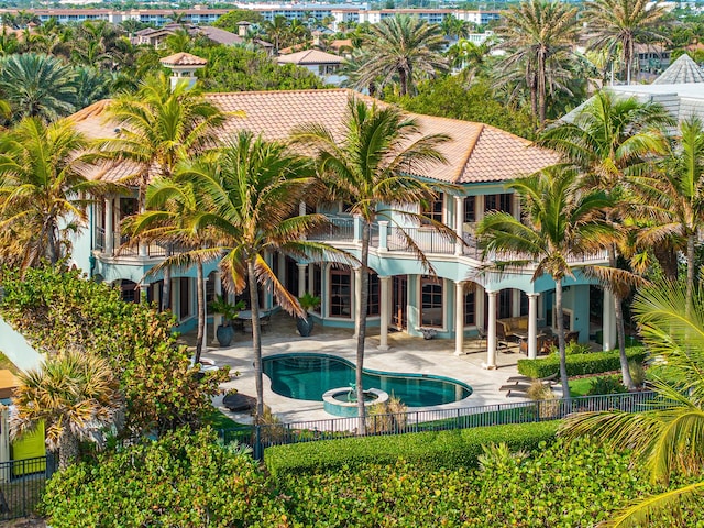 view of pool with a patio and an in ground hot tub