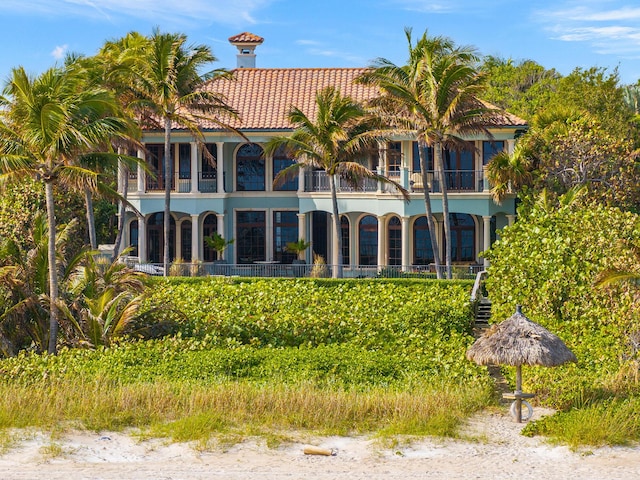 rear view of property featuring a balcony