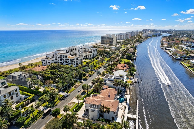 aerial view with a water view and a view of the beach