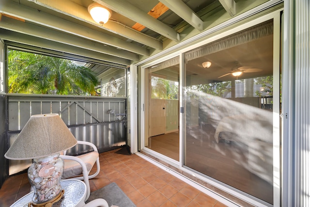 sunroom featuring ceiling fan