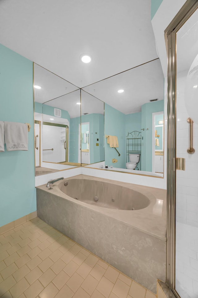 bathroom featuring shower with separate bathtub, toilet, and tile patterned floors