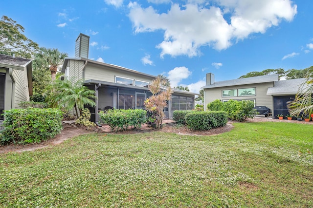 view of yard with a sunroom