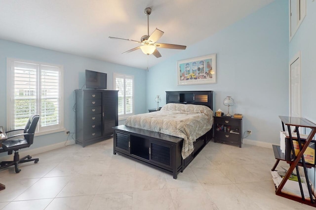 bedroom featuring ceiling fan, light tile patterned floors, and vaulted ceiling