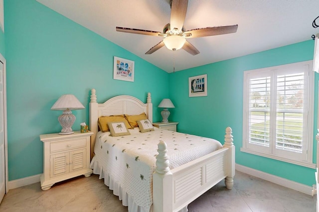 bedroom featuring ceiling fan and vaulted ceiling