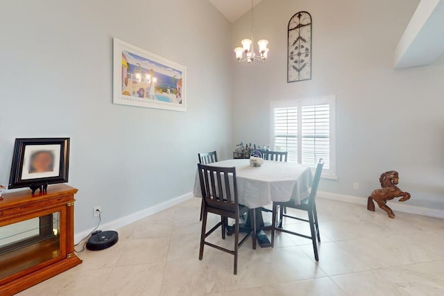 tiled dining space with a chandelier and high vaulted ceiling