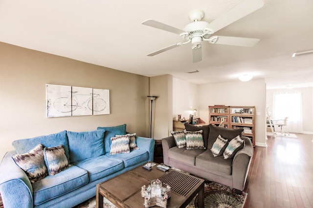 living room with hardwood / wood-style floors and ceiling fan