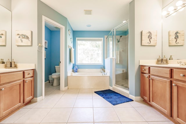 full bathroom featuring vanity, separate shower and tub, and toilet