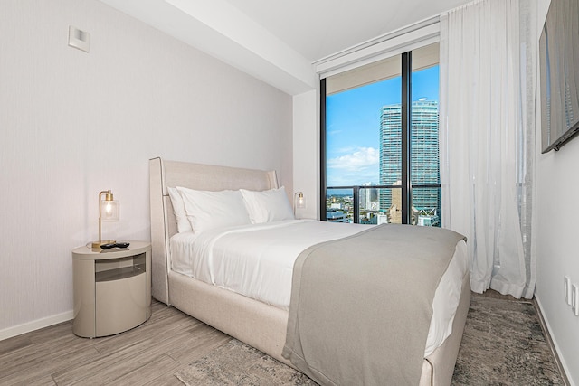 bedroom with hardwood / wood-style flooring