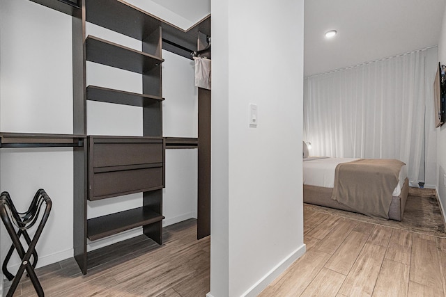 walk in closet featuring wood-type flooring