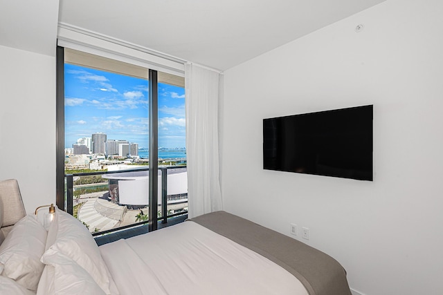 bedroom with floor to ceiling windows