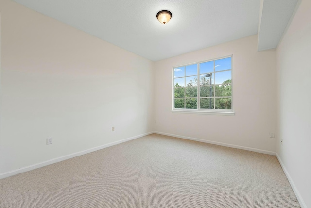 unfurnished room featuring carpet flooring